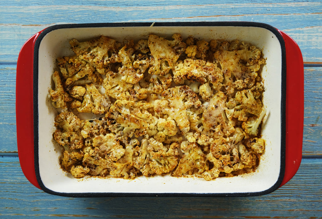 Cauliflower in an enameled cast iron roasting pan