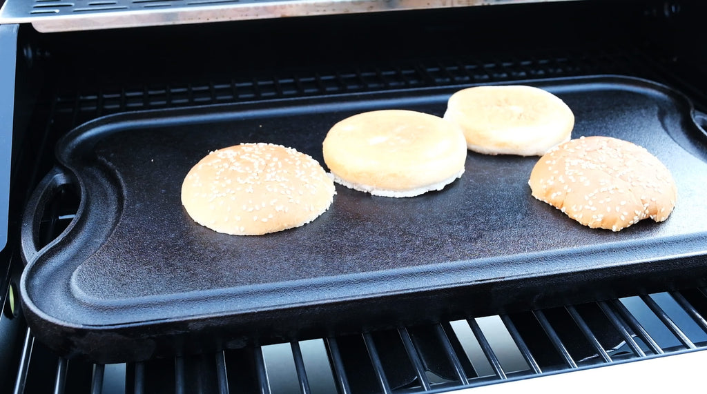 hamburger bread on a cast iron griddle