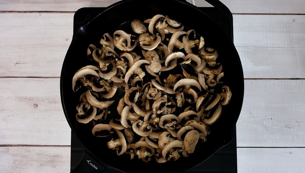 mushrooms in a crucible cookware cast iron skillet