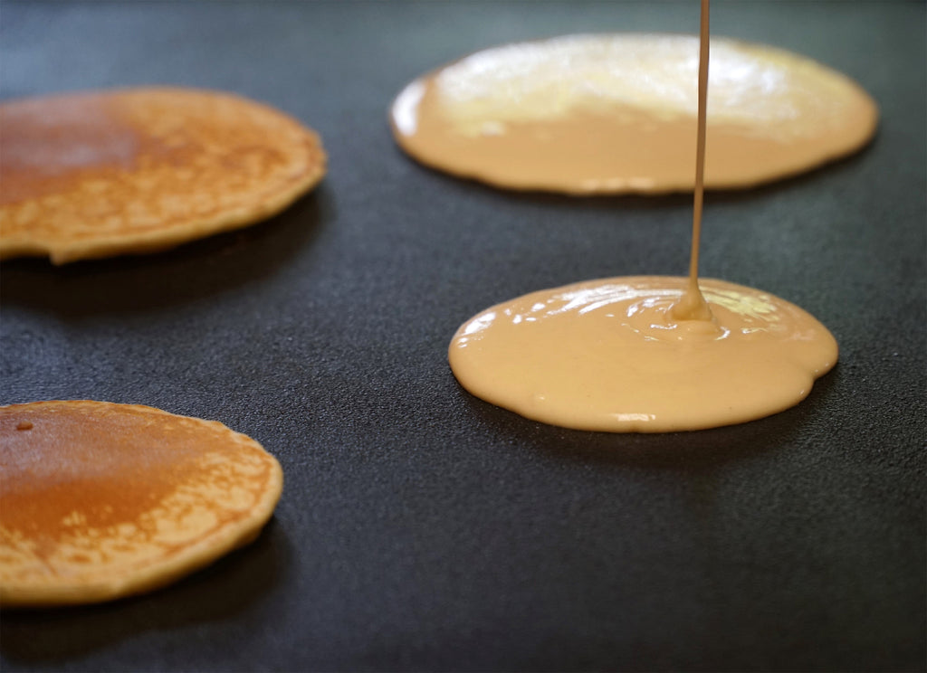 pan cakes on a cast iron griddle