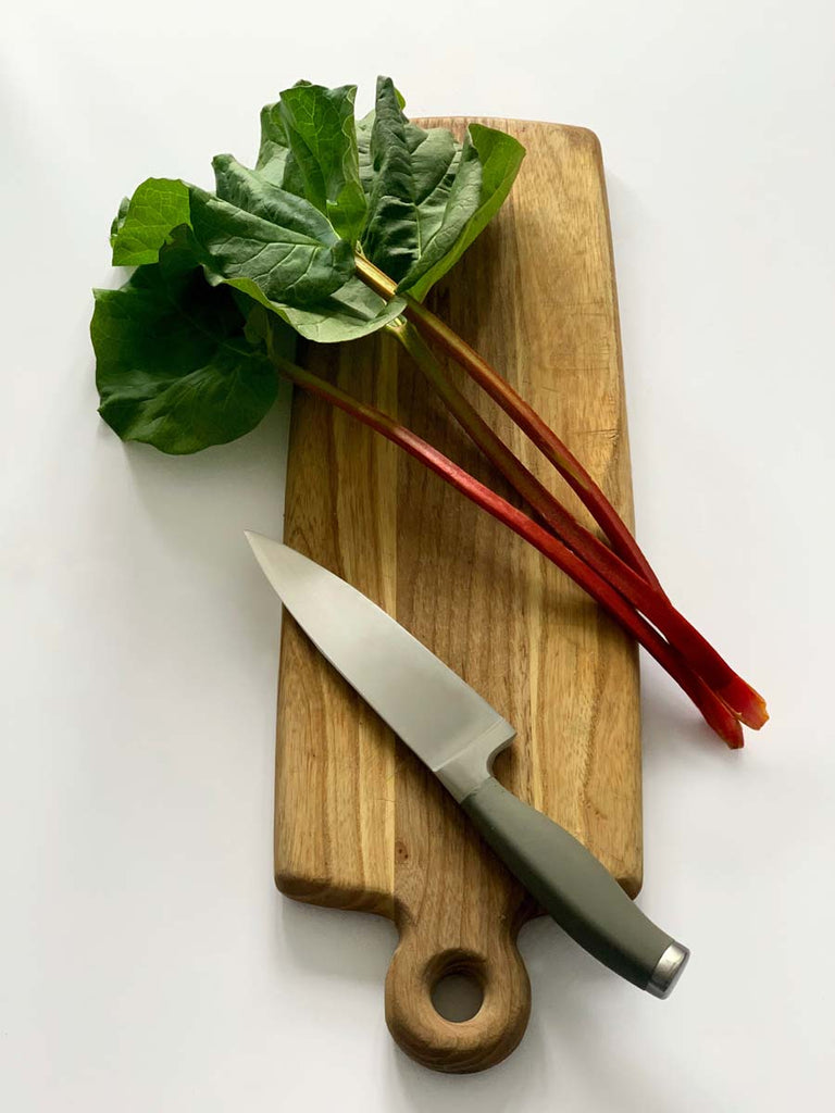 rhubarb stalks on a cutting board