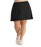 Front view, bottom half of plus size woman wearing a solid black QuikWik Lite skirted short. Slight a-line skirt with hidden undershort