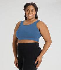 Image of a plus size woman wearing plus size sports bra and plus size leggings from JunoActive. Plus Size Activewear for women size XL - 6X.