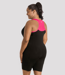 Plus Size Woman facing back wearing a plus size aquatard, leg length swimsuit from JunoActive. Plus Size Women's Swimming Suit  from JunoActive.