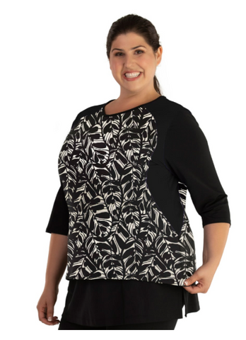 Plus size woman wearing black and white print JunoActive three quarter sleeve rash guard.