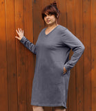 Plus size woman facing front wearing a plus size long sleeve dress from JunoActive in grey. 