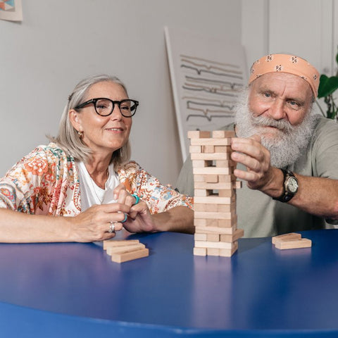 Elderly couple playing a tabletop game