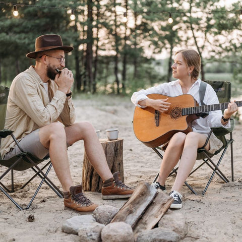 Couple at campground play instruments