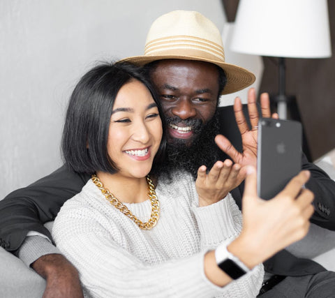 Interracial couple taking  selfie