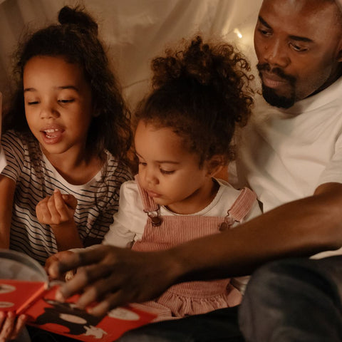 Father reading to children