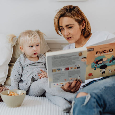 Mother reading to daughter