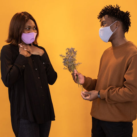 Couple wearing mask to prevent spread of covid