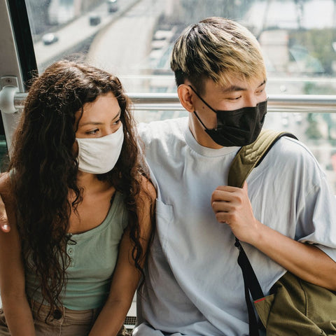 Couple wearing mask to prevent spread of covid