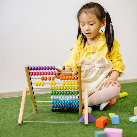 Kids learning on abacus