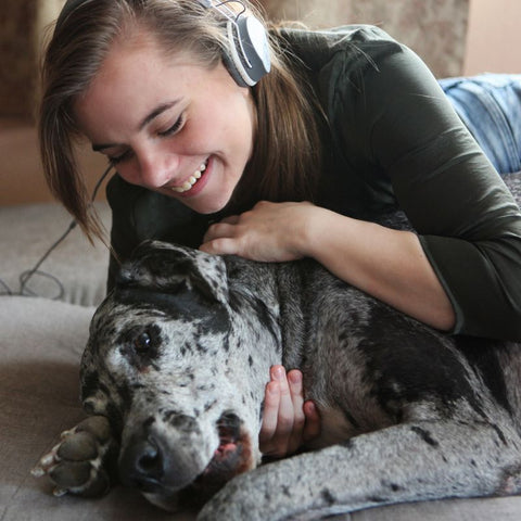 Dog Owner and Dog Enjoying Music