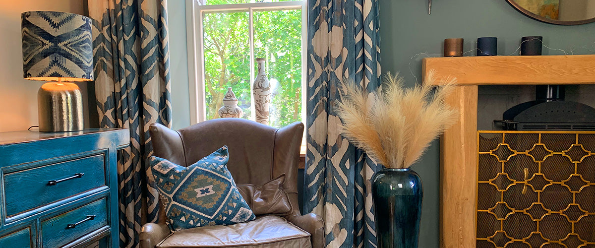 Fireplace with Ikat Cushions and Curtains in indigo Blue