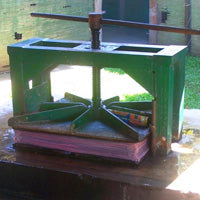 paper sheets being pressed