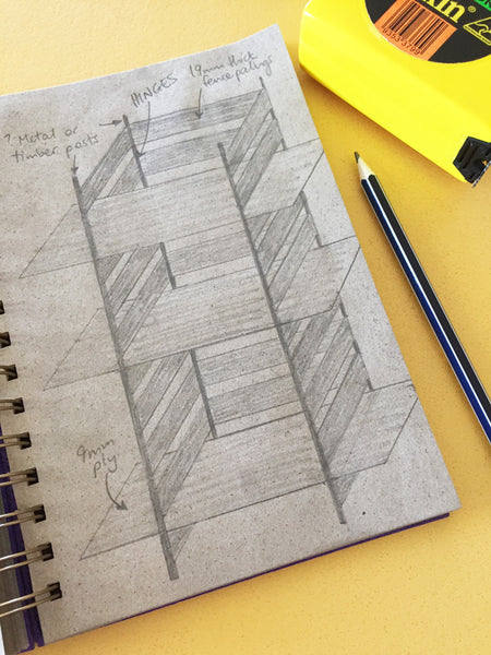 shelf design drawing in a dot grid notebook