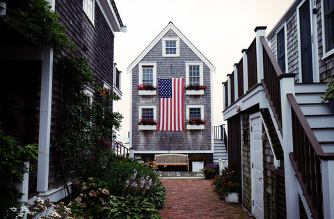 patriotic house with flower boxes