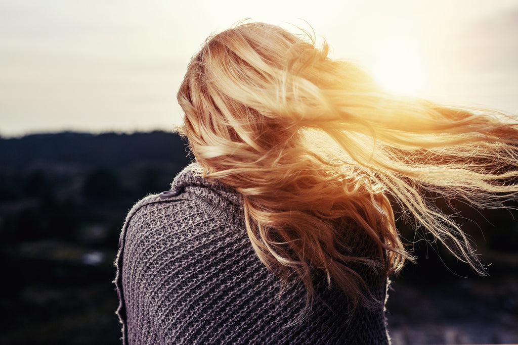 blonde hair woman in wind