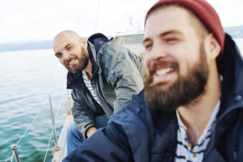 smiling men on boat