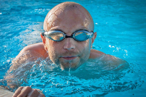 bald man in pool 