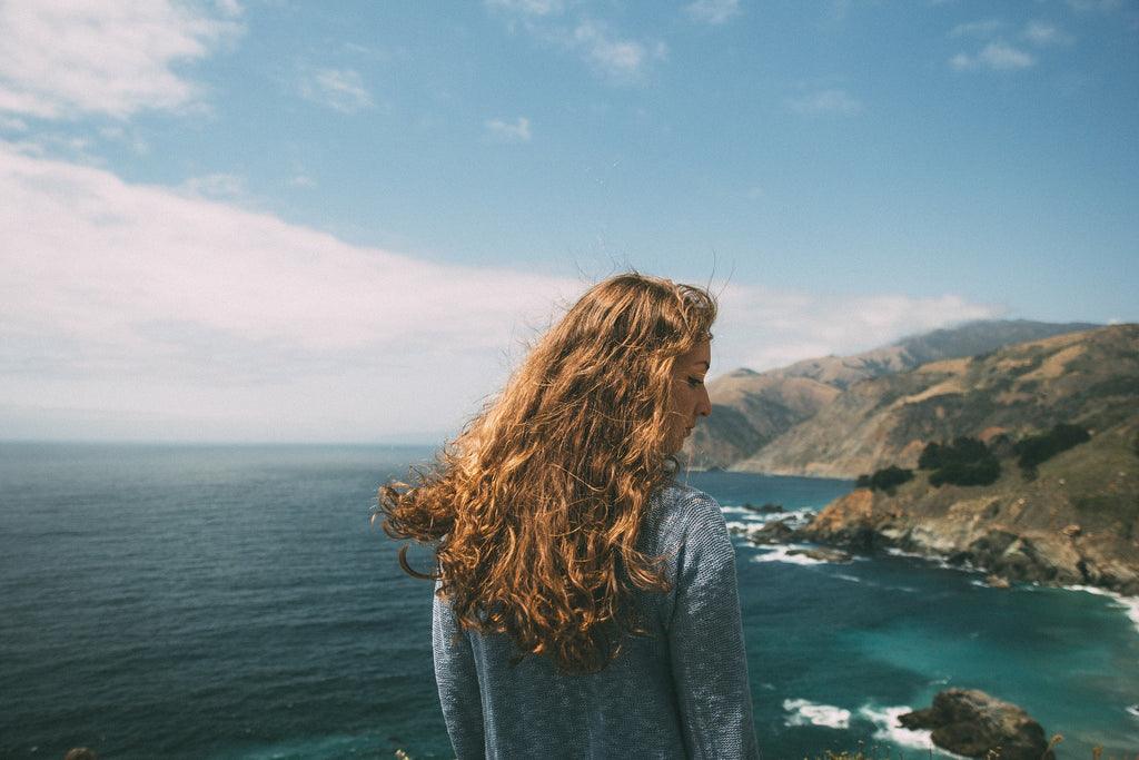 long hair brunette woman lake