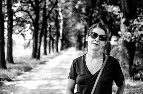 black and white woman on road