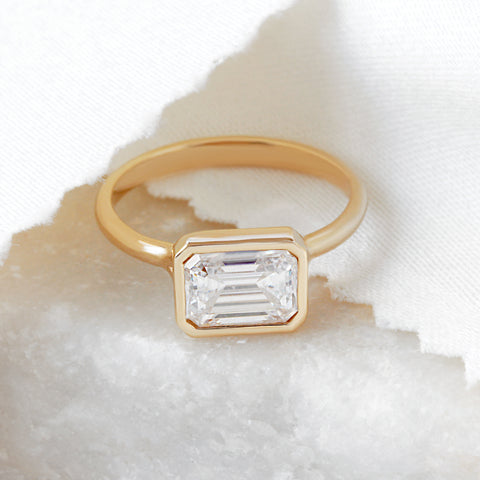 Emerald cut diamond solitaire bezel set diamond engagement ring