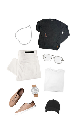 An outfit consisting of a dark gray alpaca crew neck sweater, white jeans, a white t-shirt, silver chain, dark gray baseball cap, glasses, and brown leather watch and sneakers.