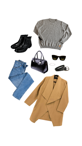 An outfit consisting of a light gray alpaca crew neck sweater, tan long jacket, black leather boots, belt, and purse, light blue jeans, and a pair of black sunglasses.