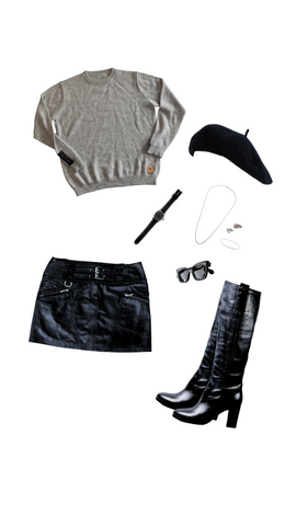 An outfit consisting of a light gray alpaca crew neck, black leather skirt, heeled boots, and watch, a black beret, black sunglasses, and silver jewelry.