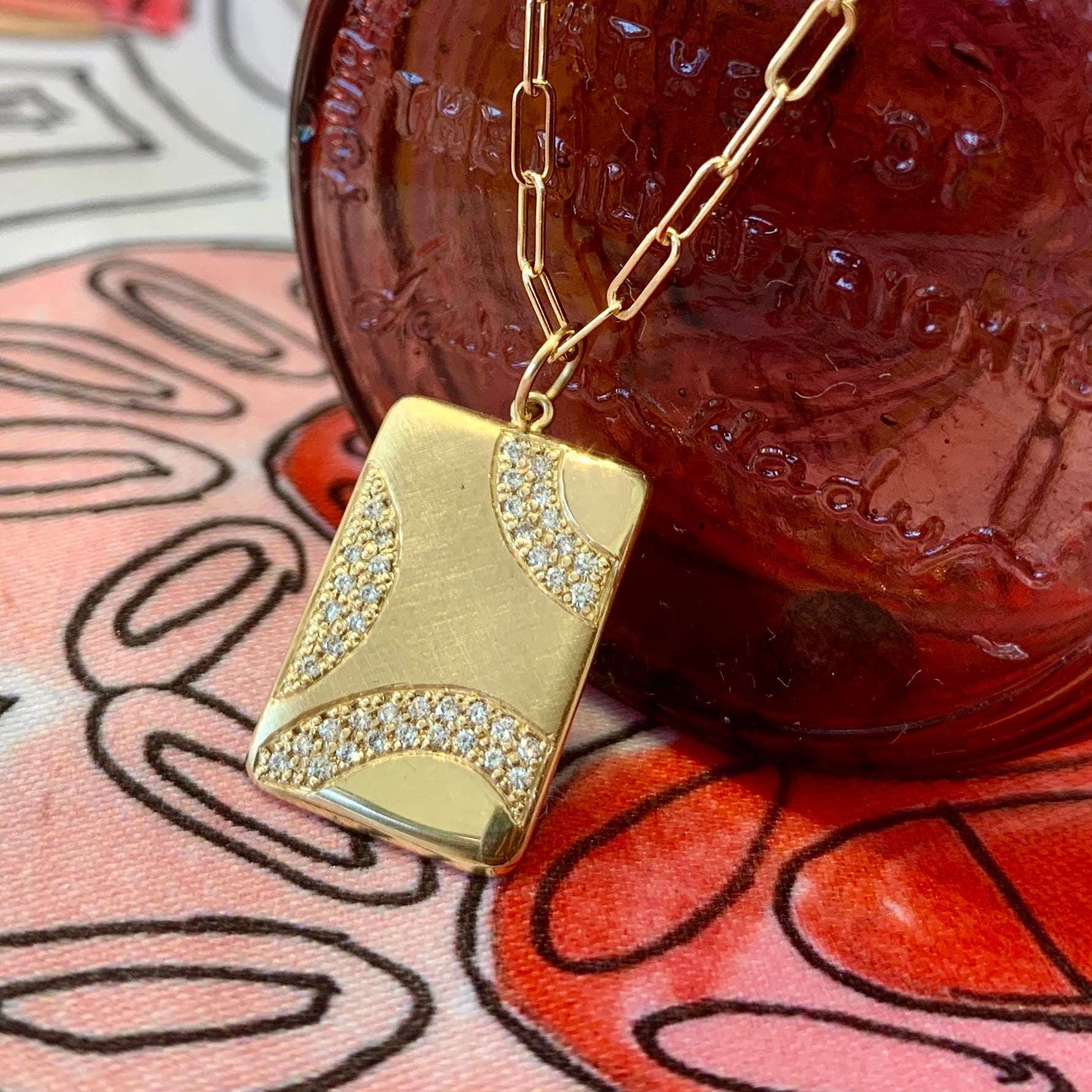 14k gold CAVE pendant with diamond swirls