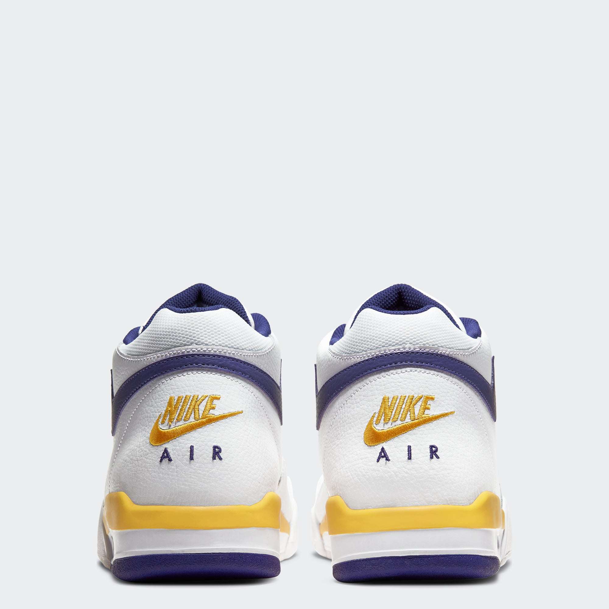 gold and purple nike shoes