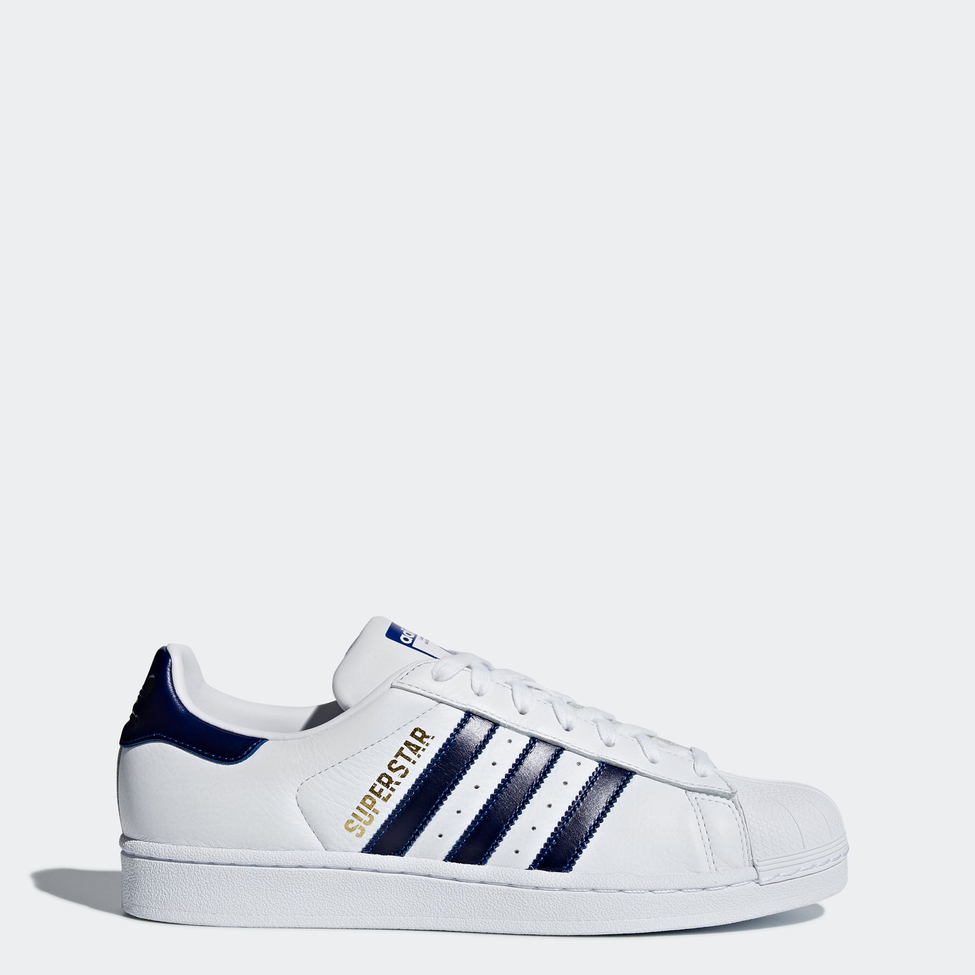 white and navy adidas shoes