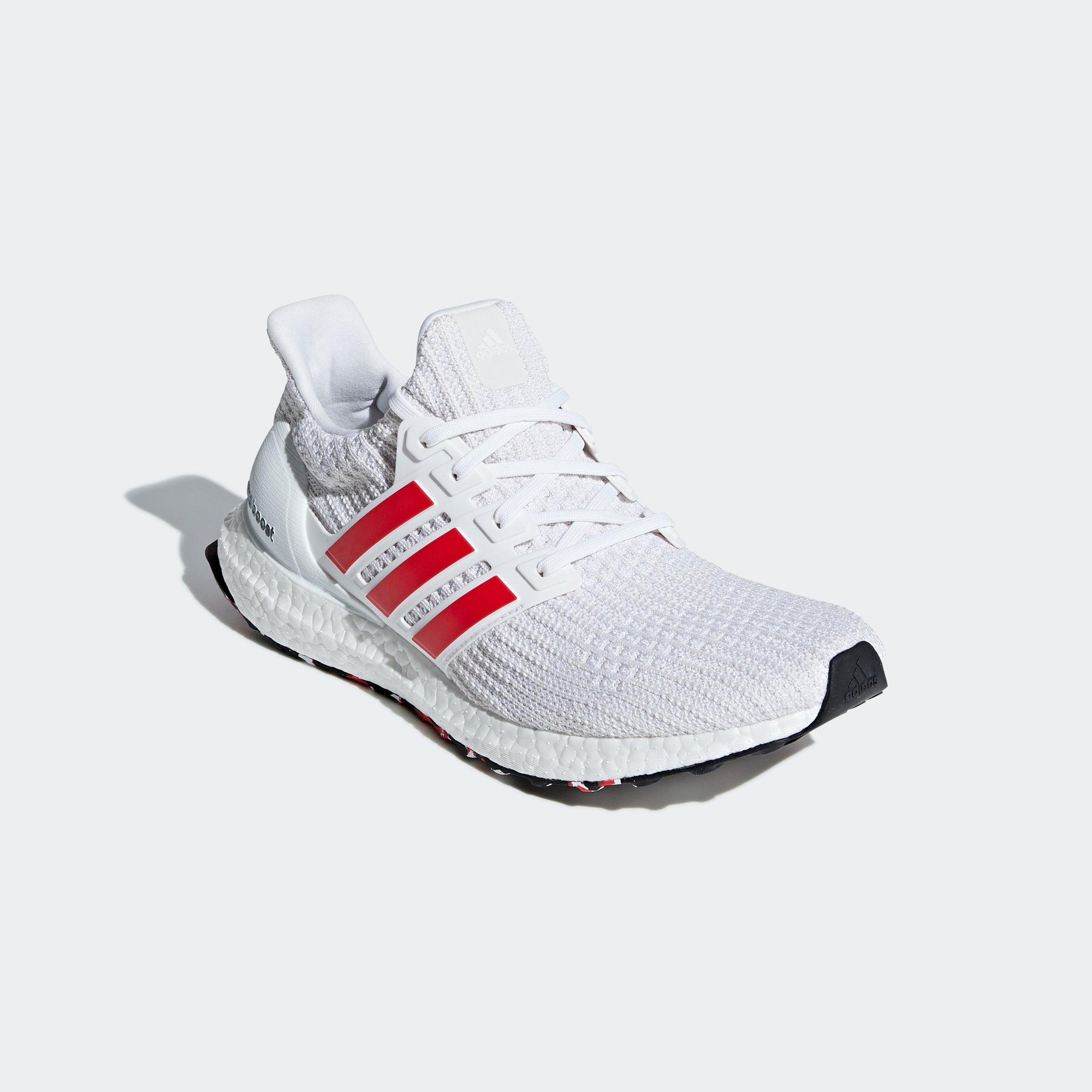 red and white adidas running shoes