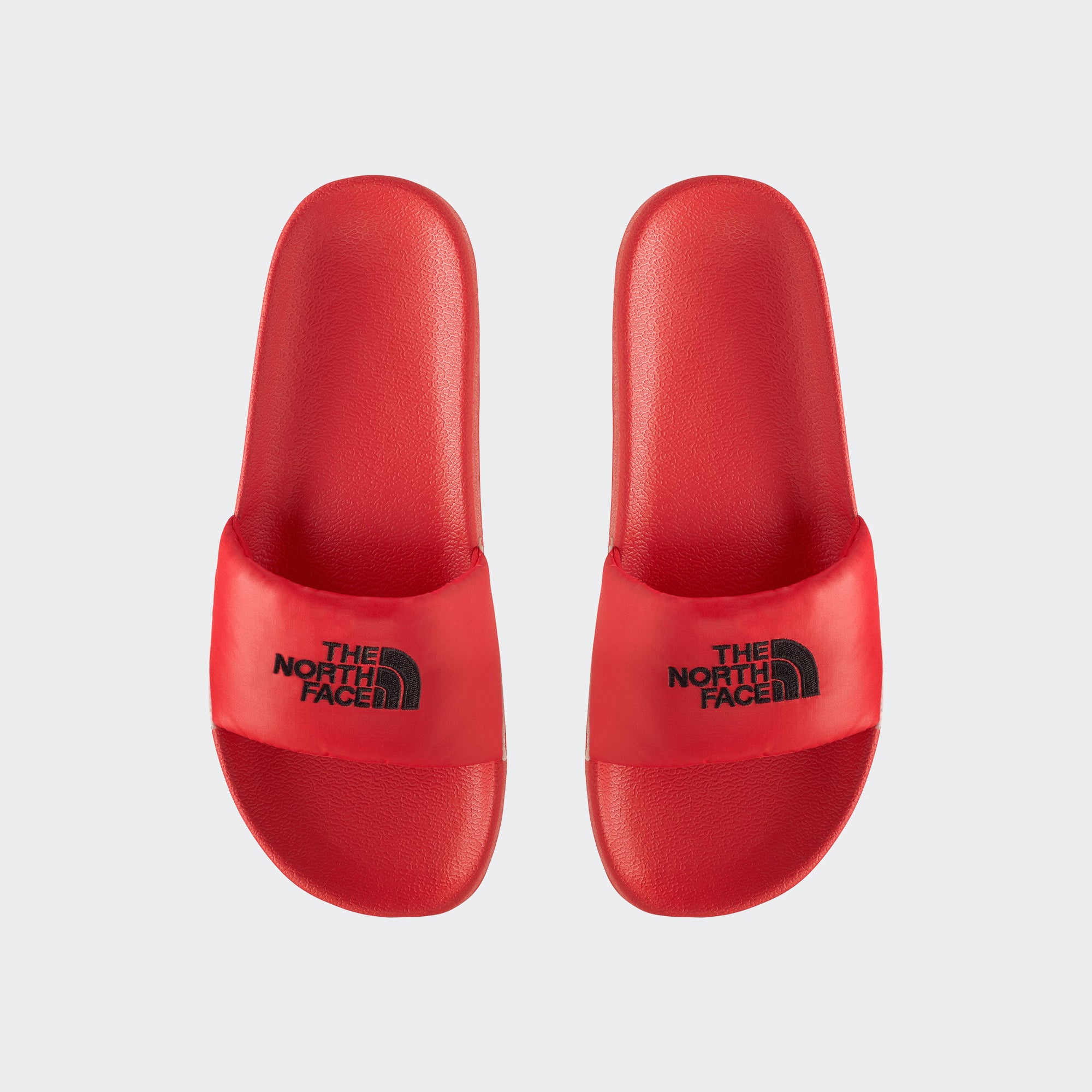 red north face sliders