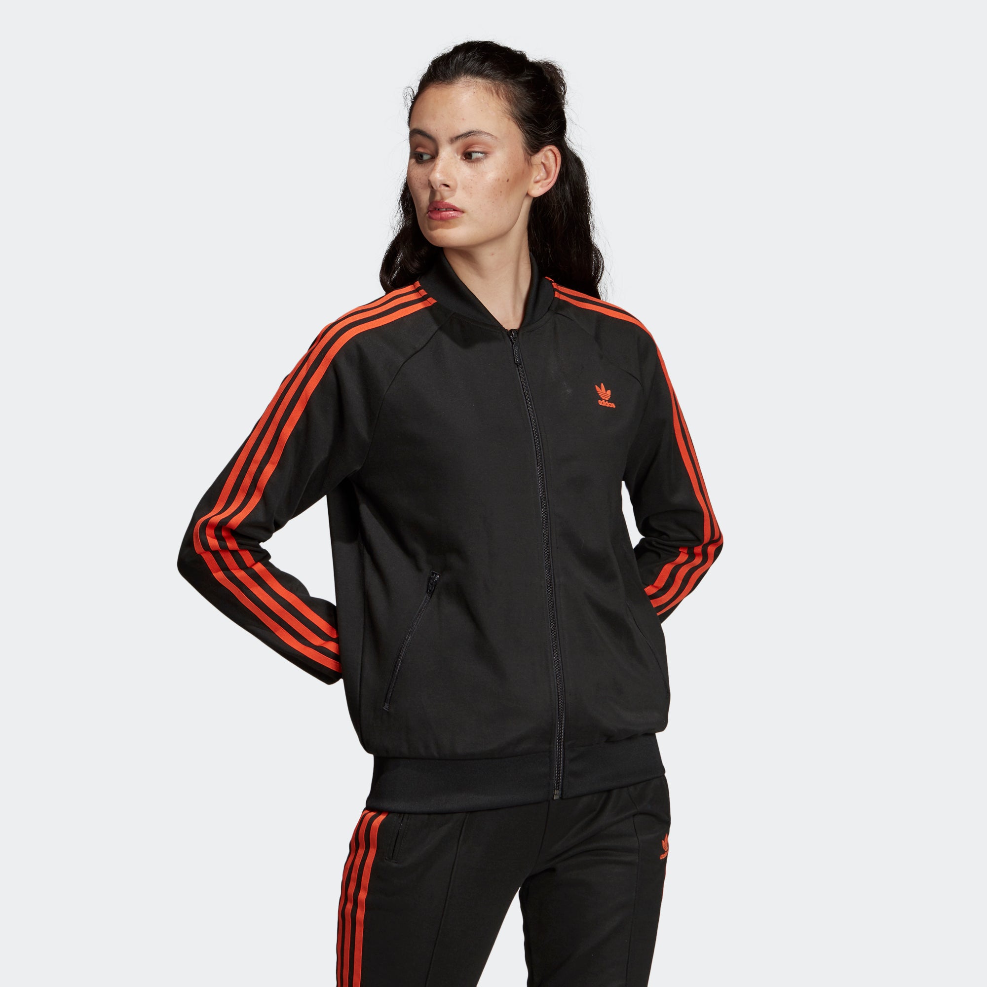 adidas originals three stripe track jacket in orange