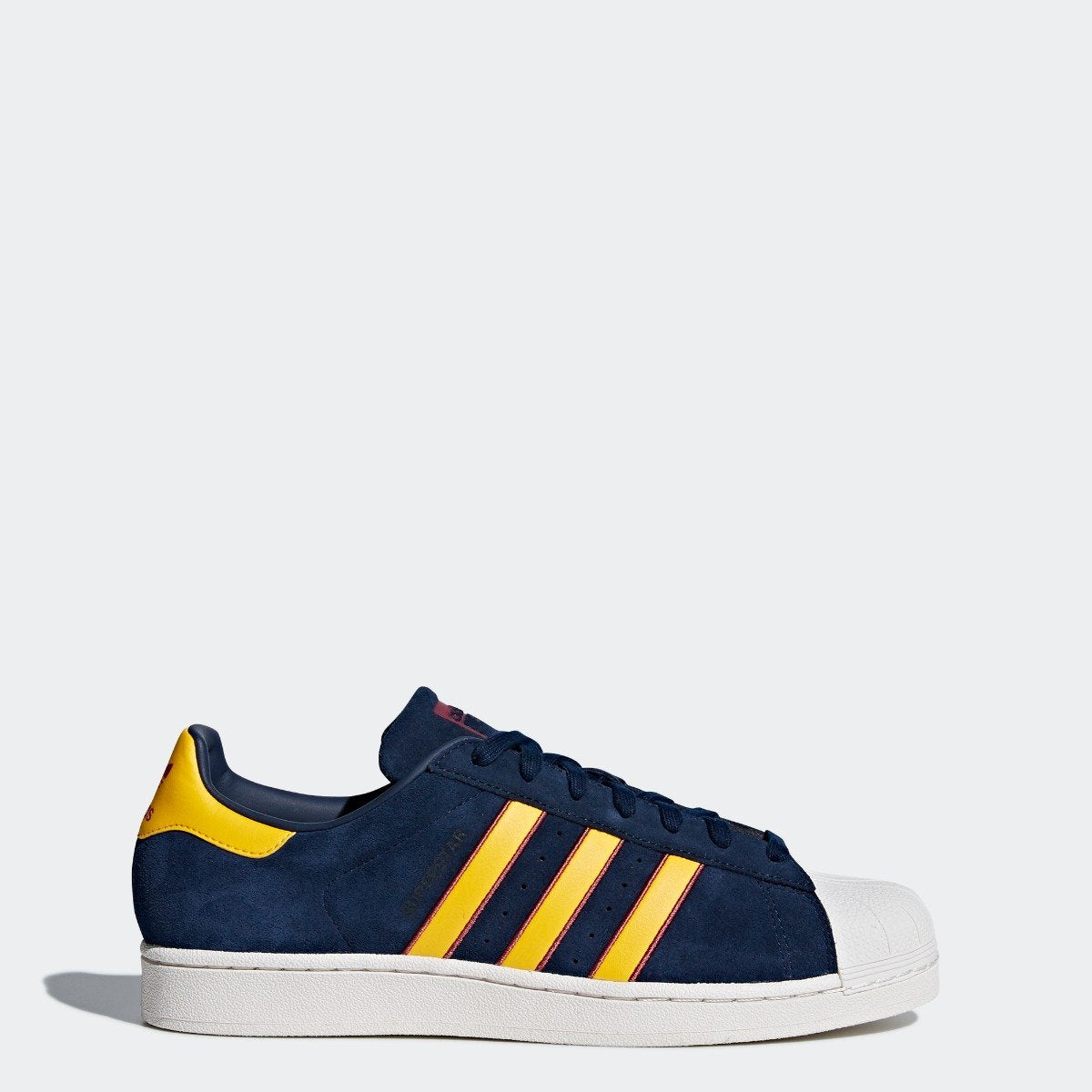 navy blue and yellow adidas shoes