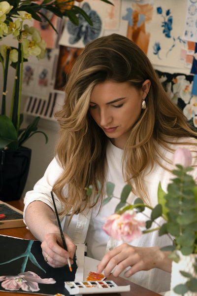 Jess Kayll hand painting artwork for KAYLL in her London studio creating textile design prints