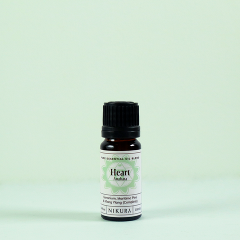 Heart chakra essential oil blend 10ml bottle with a green background