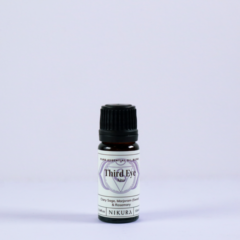 Third Eye chakra essential oil blend 10ml bottle with an indigo background