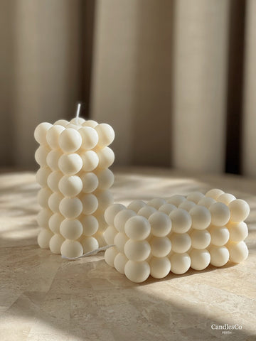 Two white bubble candles in a rectangular shape
