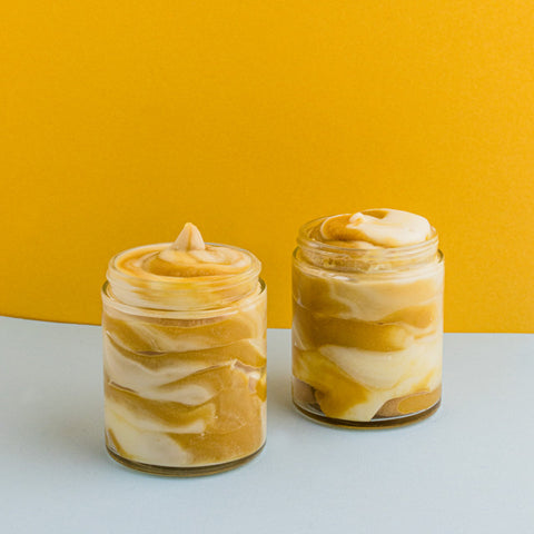 Caramel scoopable wax melt with a yellow background