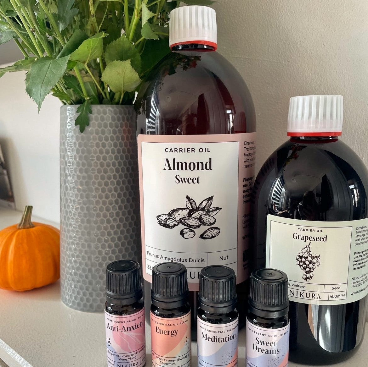 Amber Glass bottles with dried patchouli herbs surrounding