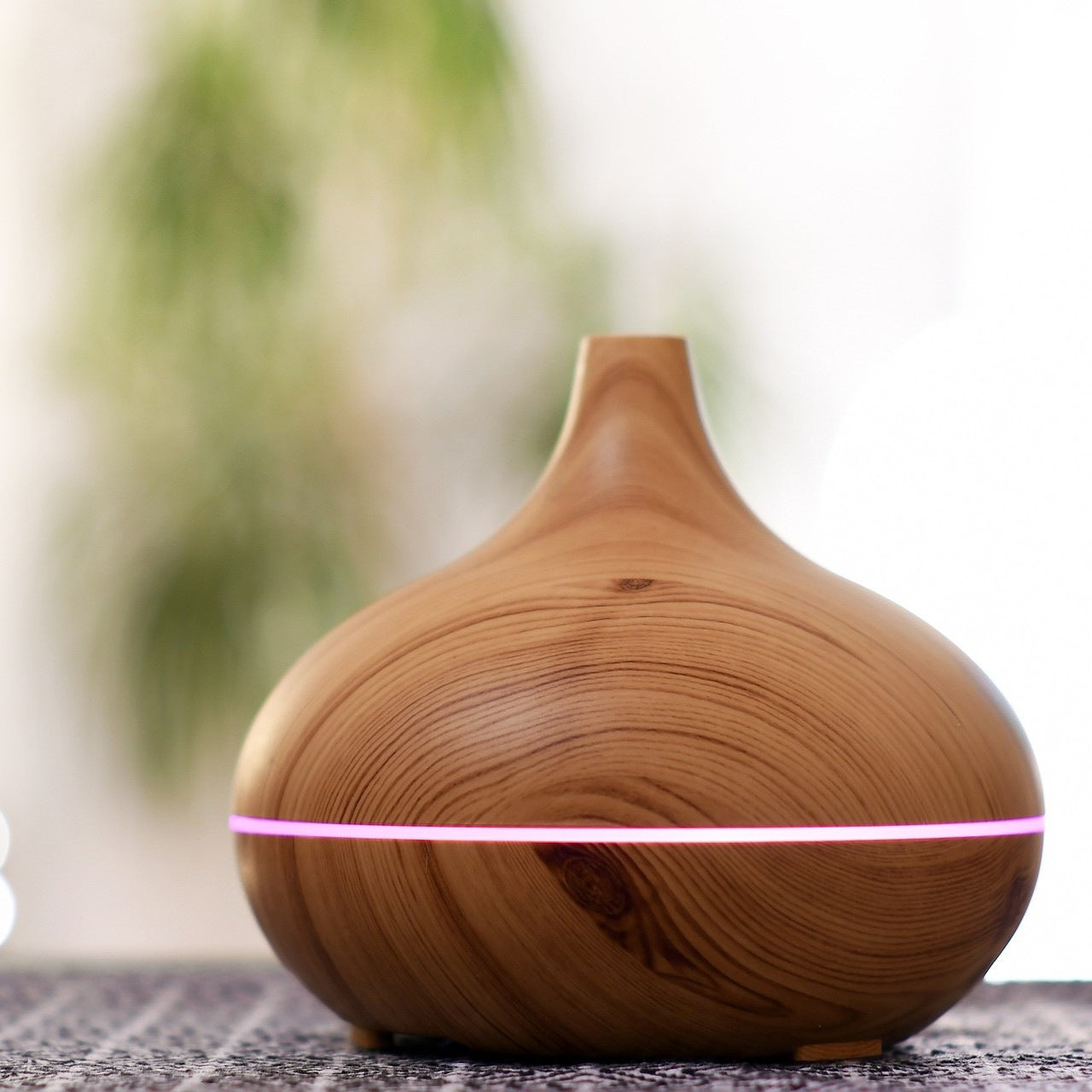 Wooden diffuser on a tabletop.