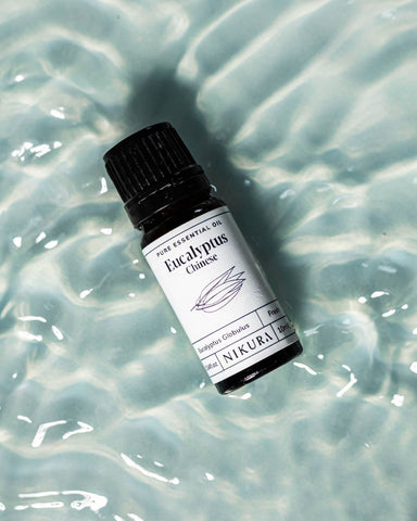 Eucalyptus 10ml bottle of oil with a blue water background