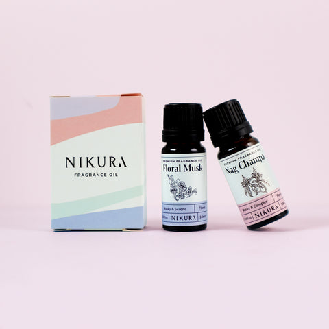 Floral Musk and Nag Champa 10mls of fragrance oil with their box on a pink background