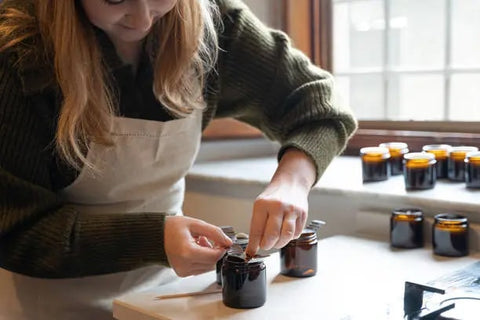 Woman making candles