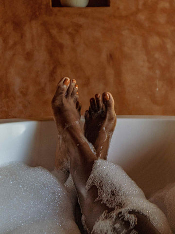 Womans feet crossed at the end of a bath